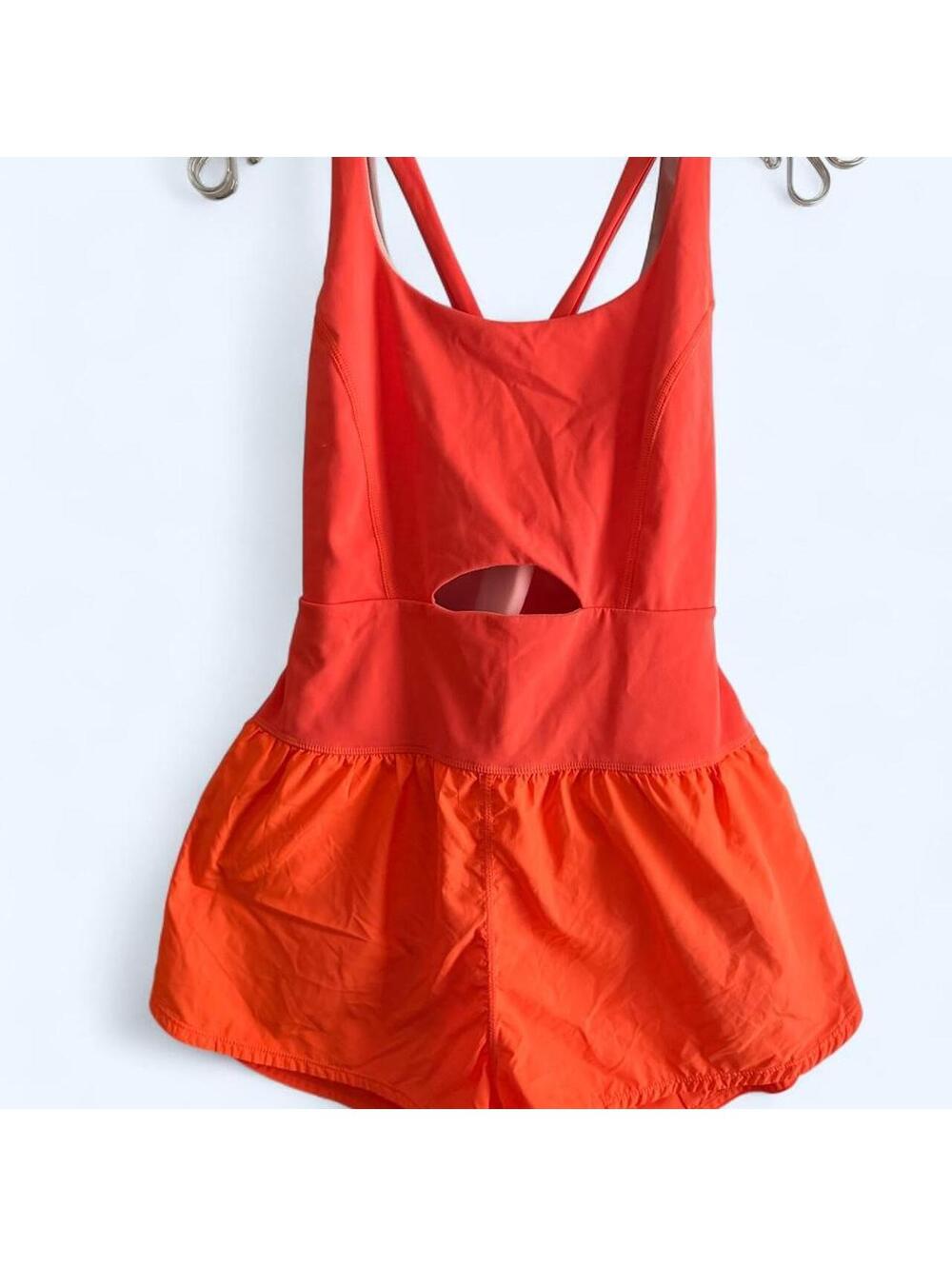 Free People Movement orange running romper with cutout detail